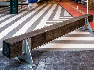 Monochrome Modern Interior with Wooden Beam and Geometric Floor Design