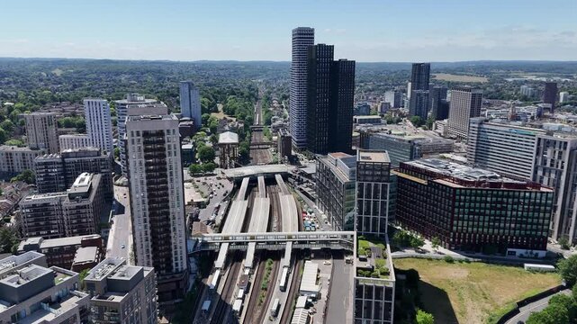 Dynamic aerial footage of East Croydon Station in London, capturing trains arriving amid modern urban development, high-rise buildings, and the vibrant energy of South London&rsquo;s transport hub.