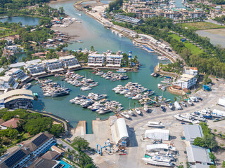 Yacht marina in Phuket, Thailand, located by the sea with scenic views of surrounding mountains....