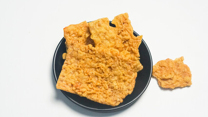 Crispy Fried Tempeh Snacks on Dark Plate