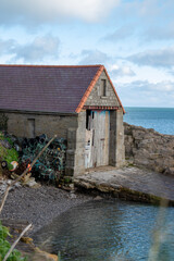 Boat house with the sea in the distance