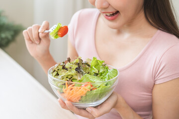 Diet concept, happy smile asian young woman use fork to prick tomato, fresh vegetable or green...