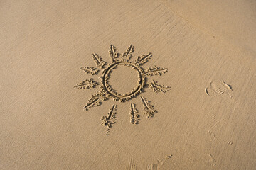 Sun Drawn On Sand Textured Background