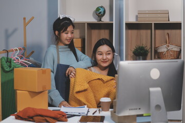 Young asian women happy after new order from customer. Surprise and shock face of asian woman...