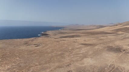 sunset from the ocean overlooking the desert area