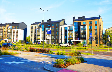 Parking for disabled people. Residential condominium block building. New Modern complex of Apartment residential condo. Residential architecture exterior. Modern facade building.