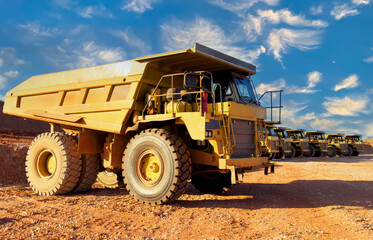 Mining truck in open-pit mining. Heavy machinery Construction equipment. Haul truck at construction site. Mining civil works, Earthmoving. Off highway Trucks on construction. Haul dump truck on sunset