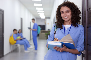 Medical student in uniform with books indoors, selective focus