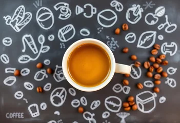 Fotobehang White coffee cup top view, chalk coffee bean doodles on blackboard,  grain,  dark © Watcharkorn