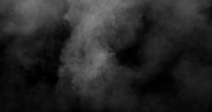 Smoke fills the space from the center of the frame on a black background. Realistic fog overlay from clouds of smoke. Just drag it and change the blending mode to screen or add.