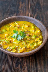 Rustic bowl of mango salsa bursting with color and fresh tropical flavor