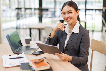 Business woman signs an electronic document on a digital document on a virtual tablet laptop...