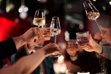 Hands Raising Glasses at Party Celebration