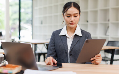 Business woman signs an electronic document on a digital document on a virtual tablet laptop...