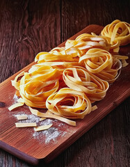 Pasta drying on a wooden pastry board- room for text AI