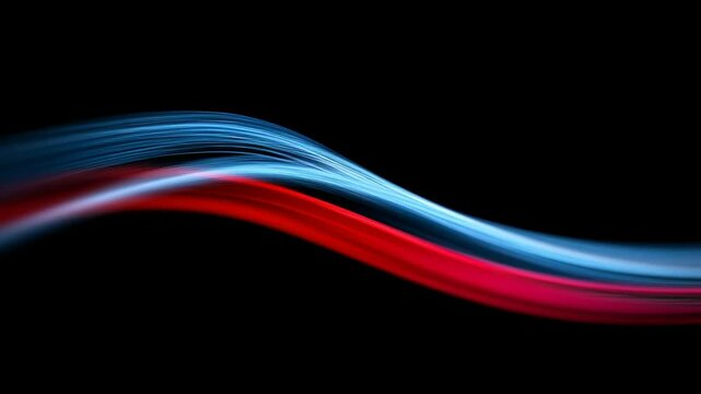 Dynamic streaks of light, with blue and red hues, create a sense of motion. These abstract waves stand out against the dark backdrop. Modern, vibrant design element.