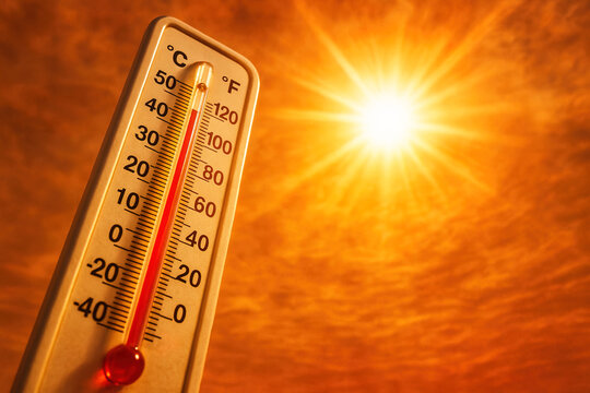 Scorching Summer Sun: Extreme Heat Thermometer Stock Photo