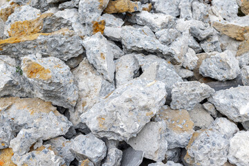 Close-up of broken concrete pieces in grey and beige tones