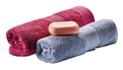Spa Essentials: A set of folded, plush towels in contrasting hues, accompanied by a bar of soap, presenting a serene scene that evokes relaxation and comfort. 