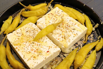 Baked feta cheese with pepperoni and onions	