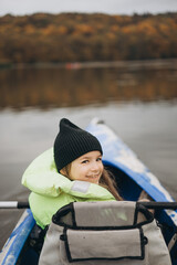 a portrait of a happy girl who went canoeing and got a lot of emotions of pleasure