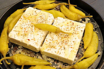 Baked feta cheese with pepperoni and onions	