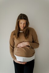 Pregnant Woman Cradling Baby Bump