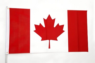 Canadian national flag featuring red maple leaf on white and red stripes