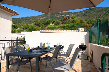Breakfast table on terrace with mountain view Corsica Sagone 12 June 2025