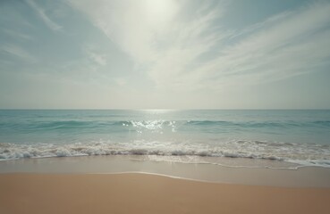 Obraz premium Tranquil beach scene. Gentle waves rolling on sandy shore. Azure ocean meets cloudless sky. Peaceful vacation, travel, coastal paradise. Sun shines, summer mood, vacation, horizon.
