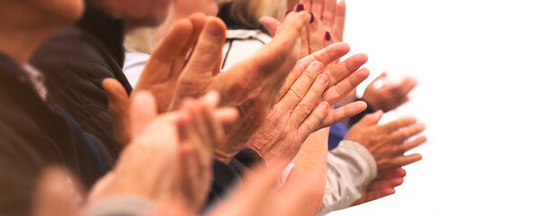 Applause - Clapping hands of a group of people in a row on white background. Grateful senior adults applauding with enthusiasm. Anonymous and in casual attire.