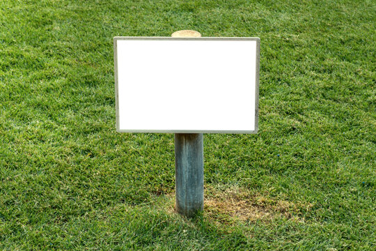 empty sign for lettering and design on a clean green lawn. a copy space.
