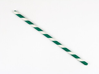Green and white striped paper straw on a white background.