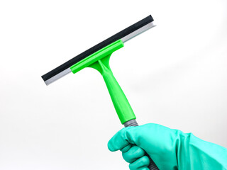 Hand holding plastic squeegee wiper isolated - on white background