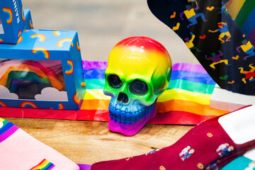 A bright LGBT skull among rainbow themed goods