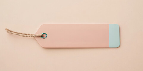 Blank tag on a soft pastel background for branding or labeling purposes.