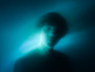 Blue and purple surreal ethereal human figure.