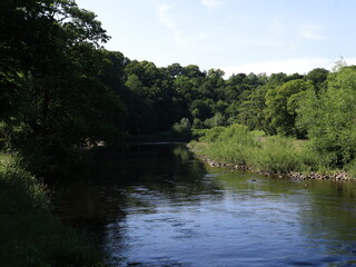 View of the river in england with old roman bridge