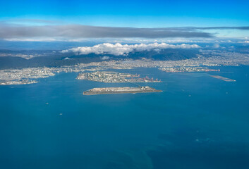 Aerial view of the Kansai International Airport (KIX) with izumisano city in background.