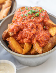 Enjoy these Delicious Loaded Potato Wedges served with a Rich and Flavorful Tomato Sauce