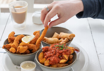 Indulge in a Delicious Meal featuring Crispy Fried Shrimp served with a variety of Dipping Sauces