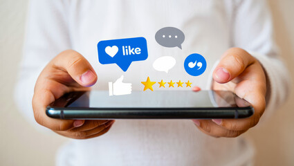 Child using social media, holding smart phone with icons of like, comment, star over it. Young kid...