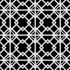 Seamless tile background. Black background with white ornamental pattern. Ancient pattern for floors and cladding. Geometric seamless pattern. Ornamental vintage background