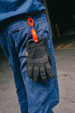 Safety work pants with black gloves