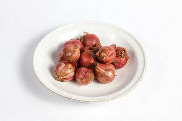 bunch of fresh shallots in a plate