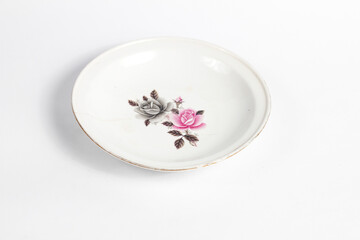 empty ceramic plate with floral pattern isolated on white background