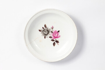 empty ceramic plate with floral pattern isolated on white background
