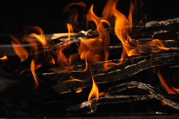 Night campfire,big bonfire against black background. Sparks of bonfire and fire. Close up