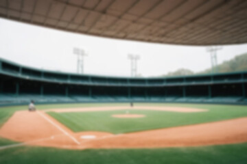 Fototapeta premium Blurry photo of a baseball field, inside a magnificent stadium with no people in sight.