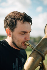 A man plays a trumpet 